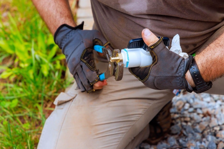 Water line repair near me: excavated Dallas TX yard with a broken underground supply line being replaced.