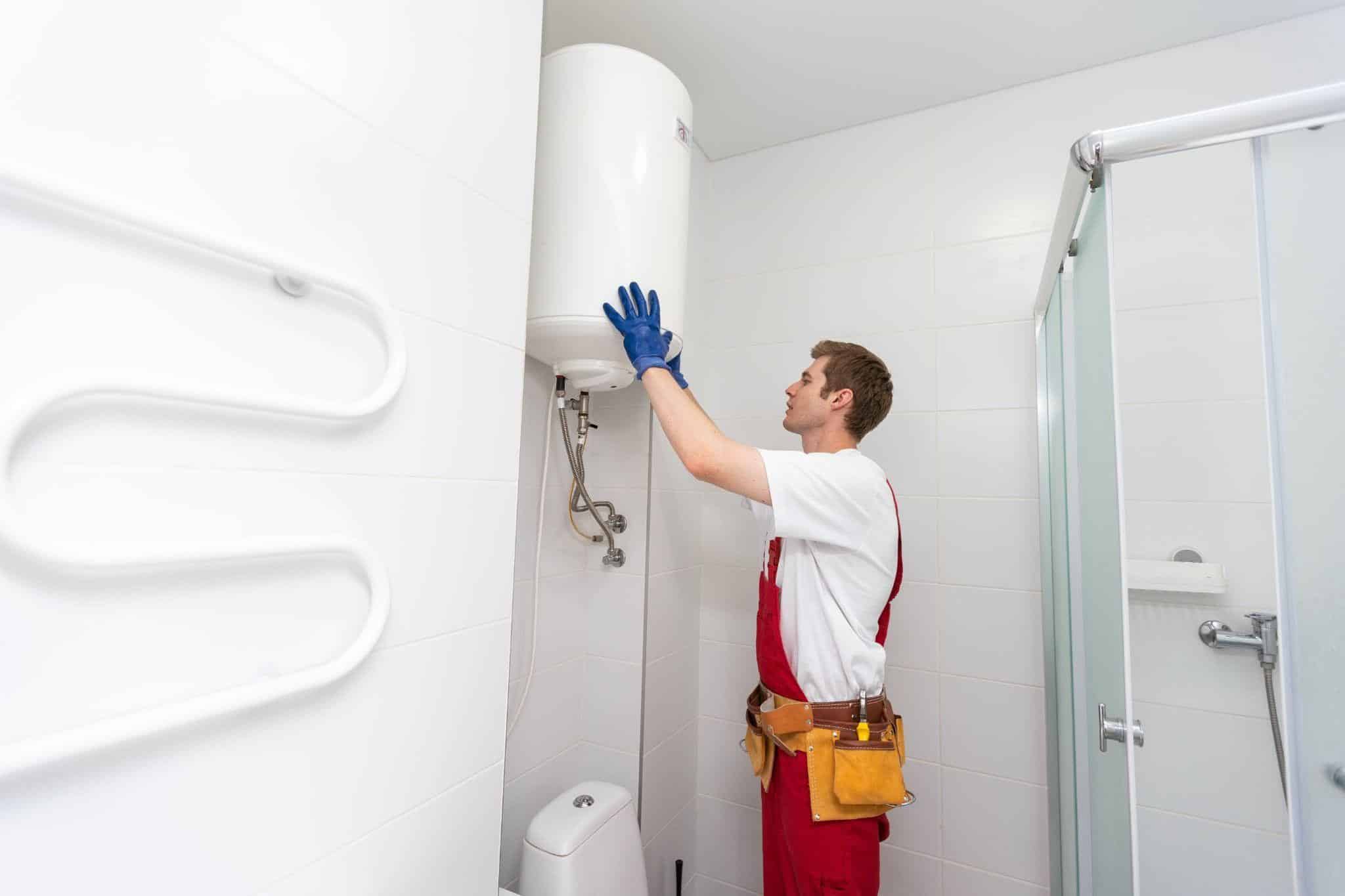 Plumbing technician completing a Dallas water heater inspection and system check.