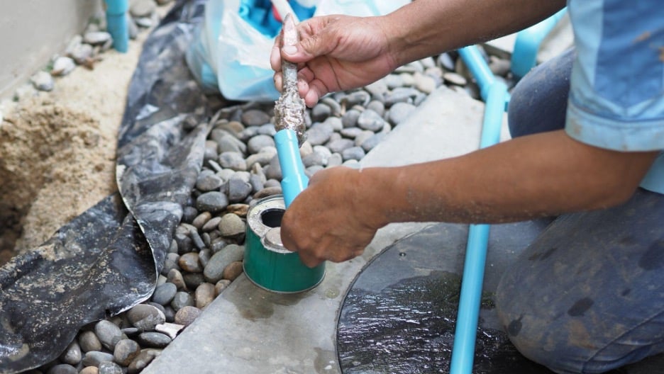 Testing drains by holding water at a cleanout to diagnose a sewer leak under the foundation in Mesquite. 