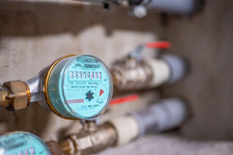 Water meter test with fixtures off helping diagnose a plumbing leak vs groundwater under a Cooper home.