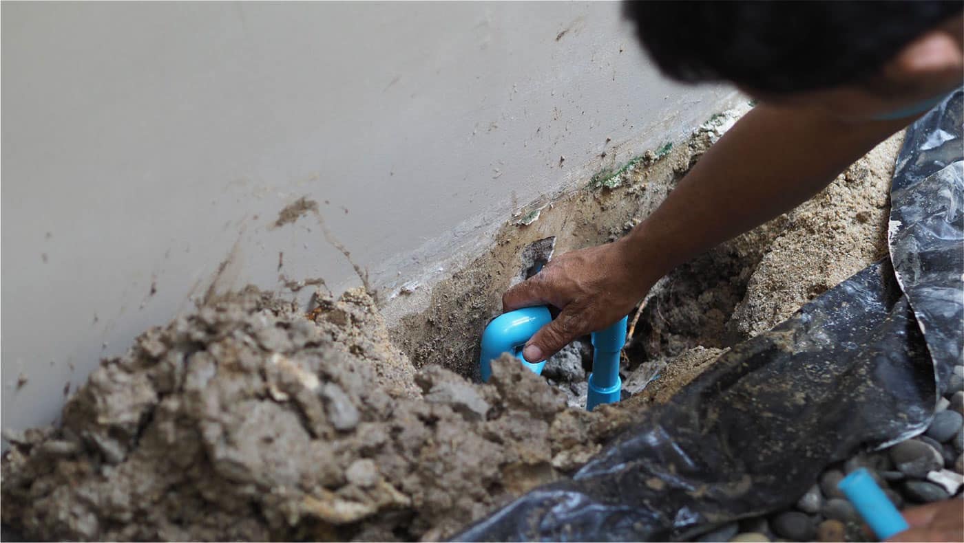 Expansive clay soil shrinking and pulling away from a slab-on-grade foundation in Irving, TX
